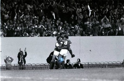 Arsenal goalscorer Tony Woodcock gets a hug from team mates Brian - Old Photo