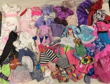 Used Vintage Barbie Doll Clothes , Purple And Pink Labels In Most Of Them