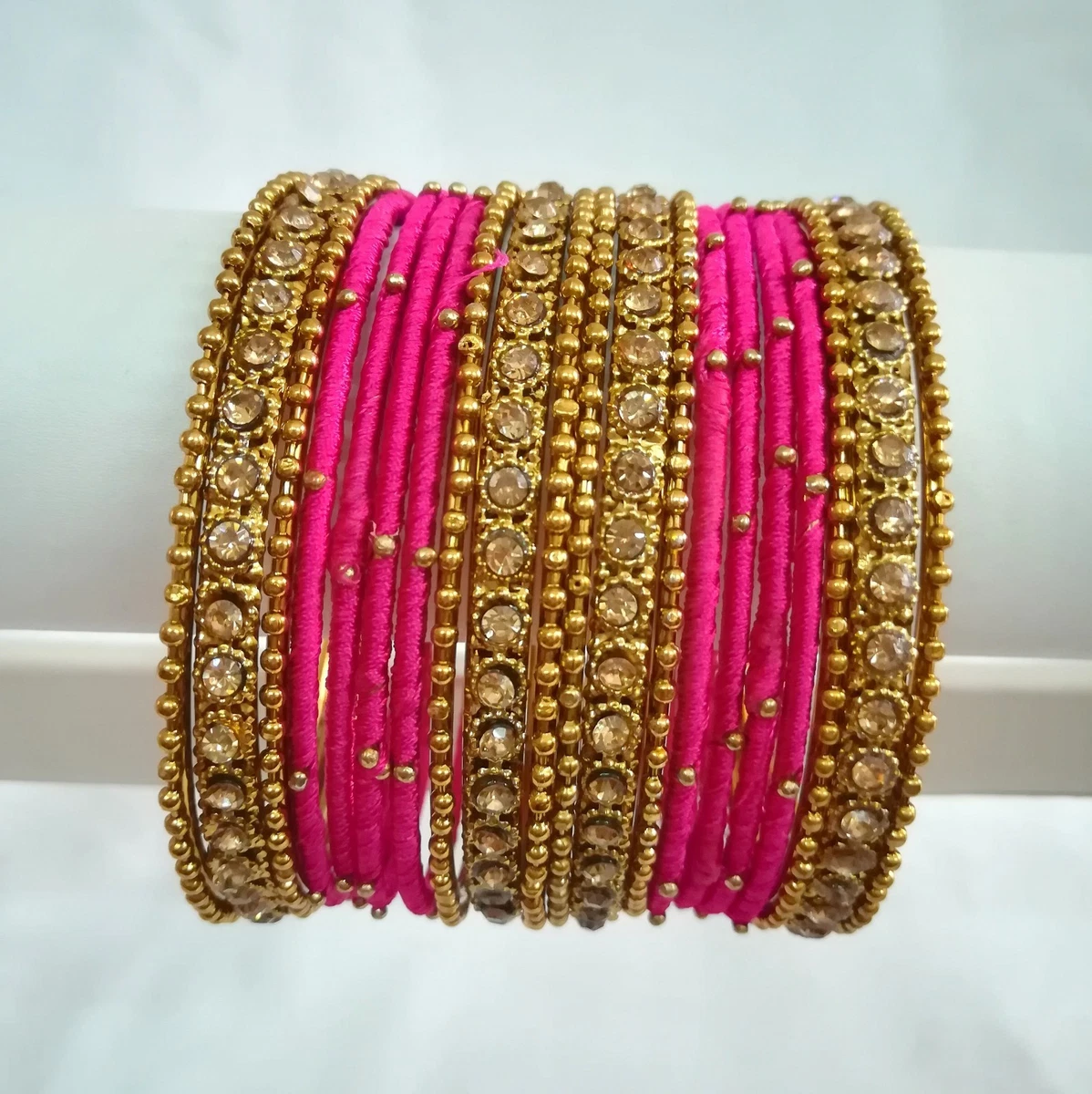 Pink and 2024 gold bangles