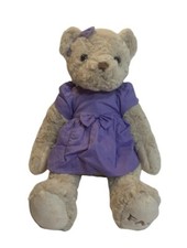 FAO Schwarz bear stuffed animal. 2016 Geoffrey, Purple dress and bow. Toys R Us