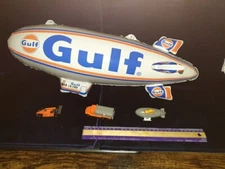 3 Gulf Inflatable 24"  Blimps and 9 piece Hot Wheel promo set ., unopened