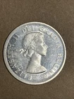 1958 Canadian Totem Pole Silver Dollar