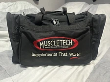 Used Muscletech GNC Black Duffel Gym Bag Zippered Pockets Mr Olympia Jay Cutler