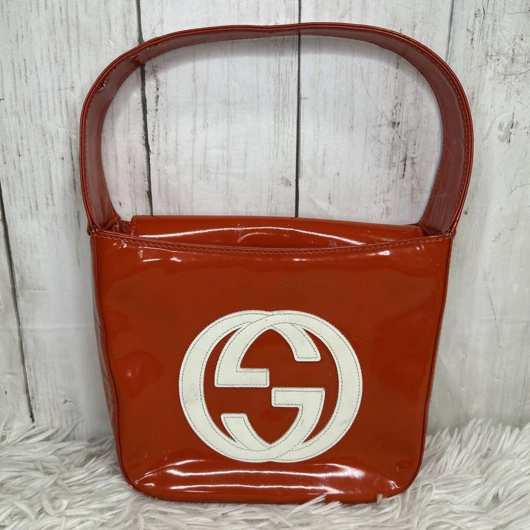 Sac à main GUCCI poches intérieures imbriquées Soho cuir verni orange formel