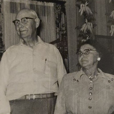 Vintage B&W Photo Snapshot of Grandparents Looking Off Camera in Kitchen 1950s