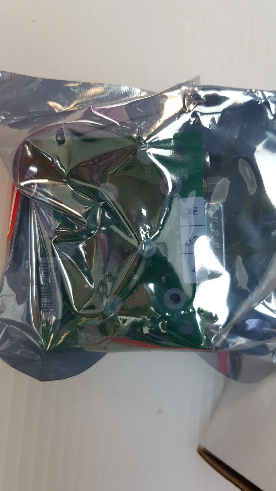 Back of the ESD bag with the green Applied Materials 0190-07033 board inside