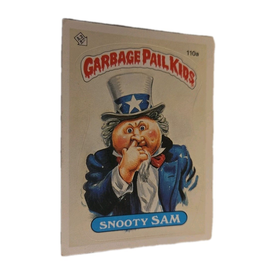 Snooty SAM #110a 1986 Garbage Pail Kids trading card — raw and PSA graded price guide