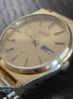 Seiko Men's Vintage SQ 6923-8009 Quartz Watch with Day/Date Gold Tone Dial Mint!