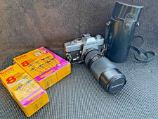 Minolta SRT 102 SLR 35mm Camera w/ zoom lens and 10 Rolls of Kodak Film