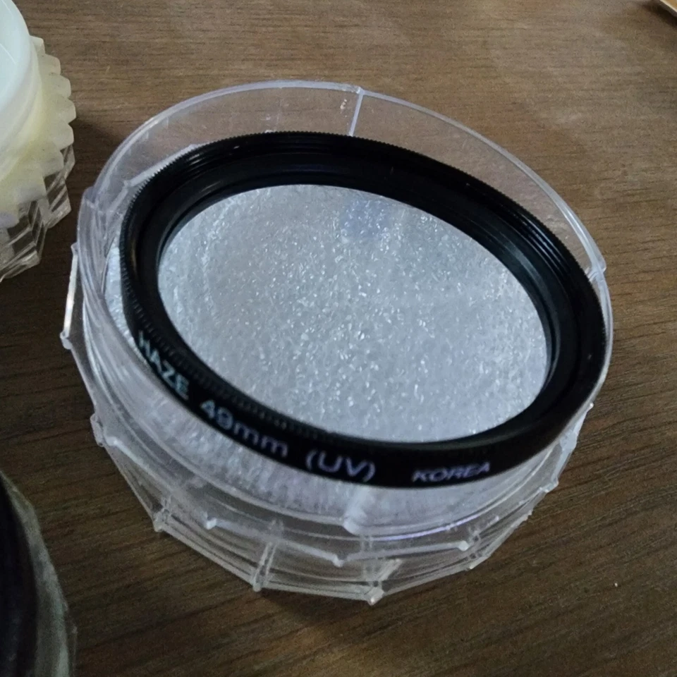 Set Vintage Camera Lenses Tiffen 49mm Yellow, Haze 49mm UV, Quantaray 52mm P.L. - Image 4 of 4