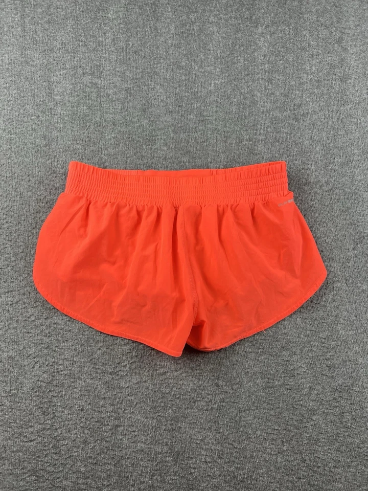 Pantalones cortos para mujer Reebok forrados en naranja talla pequeña de 2" Foto 2 de 4