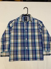 This is an IZOD Boys long-sleeve plaid button-down shirt. Size 7
