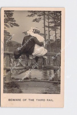 RPPC Real Photo Postcard Beware Of The Third Rail' Man Woman Sit On Fence