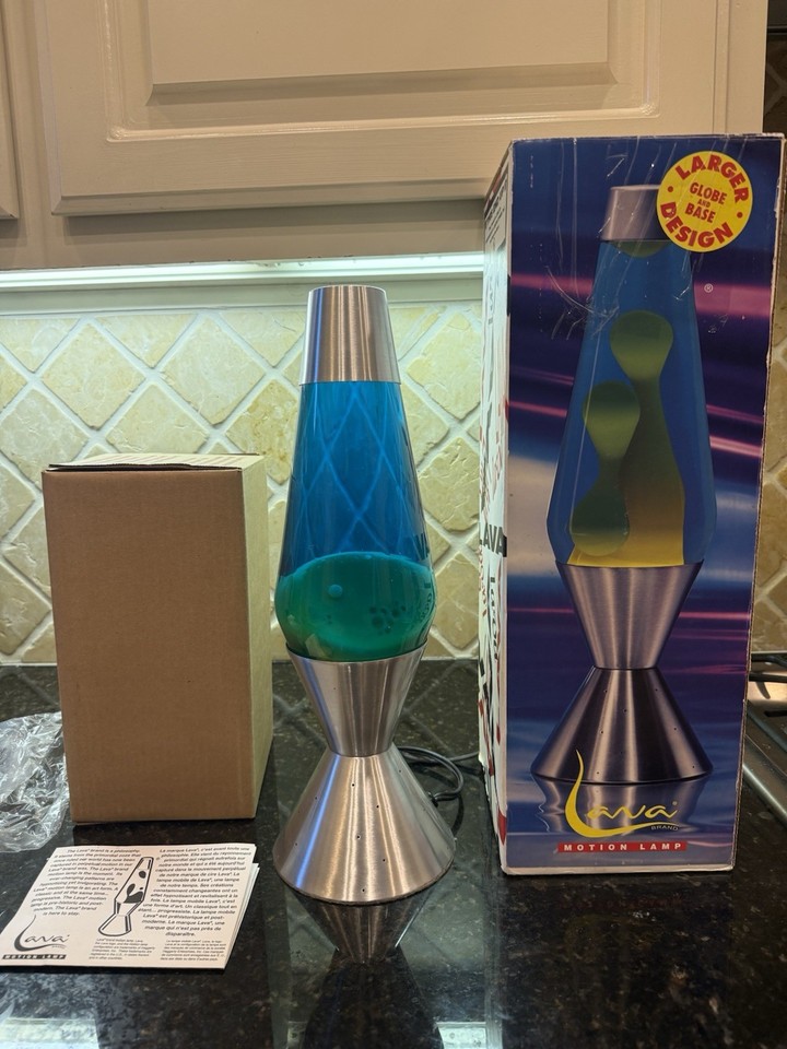 A boxed 1999 Silver Aristocrat lava lamp with the original Starlight base — a genuine Y2K collectible in display-worthy condition.