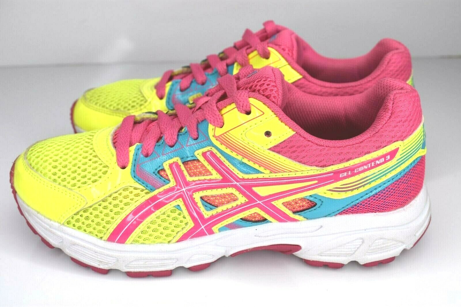 pink and yellow tennis shoes