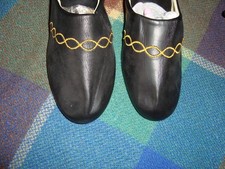 Backless slippers, with wedge heel.