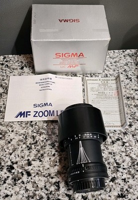 Sigma UC Zoom 70-210mm 1:4-5.6 UC MF Lens Canon AF Made In Japan w/ Box Papers