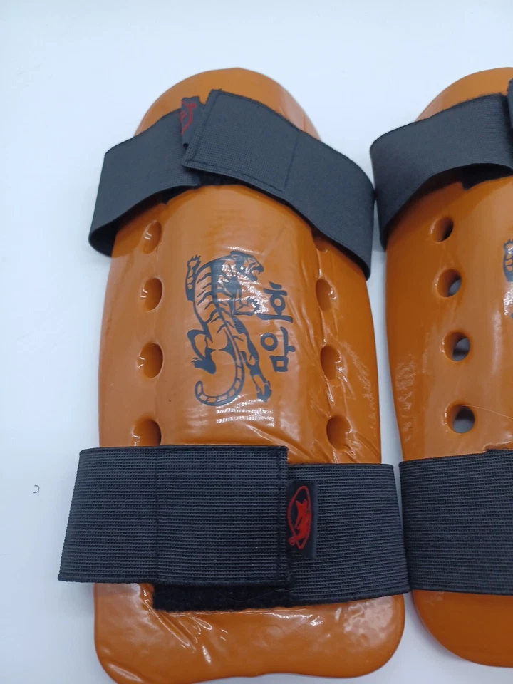 Equipo de ahorro de artes marciales Macho espinilleras juveniles patrón naranja tigre 11 pulgadas Foto 2 de 4