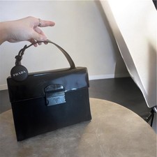 Authentic prada top handle bag black women. Luxury minimalist