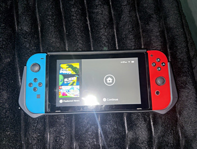 Nintendo Switch 32GB Handheld Console 720p HD w/ Red/Blue Joy-Con