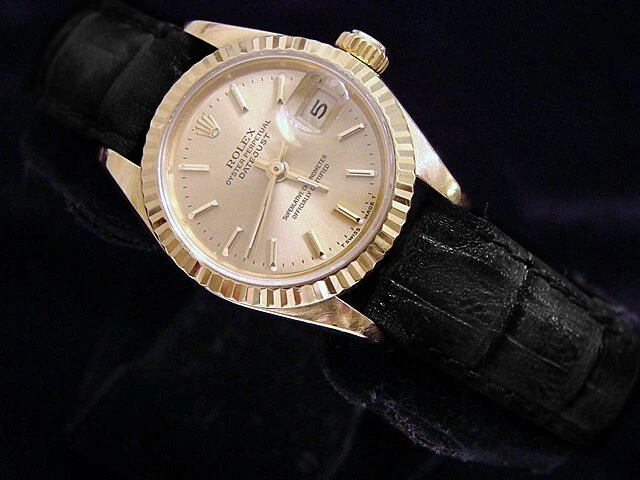 Rolex Datejust Lady reloj de oro amarillo sólido de 18 quilates correa negra esfera champán 69178
