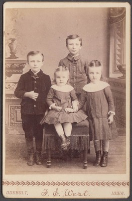 Four children group portrait cabinet by F S West Odebolt Iowa 1890s