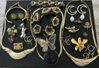 Mixed vintage and costume jewellery lot  gold-tone necklaces, earrings, brooches