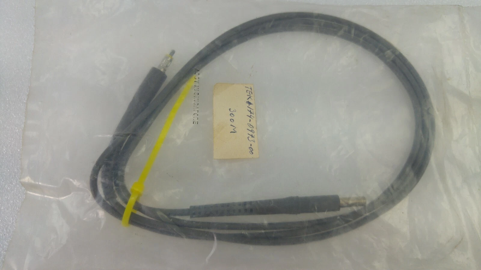 Tektronix probe cable in a bag with a handwritten 174-0973-00 tag