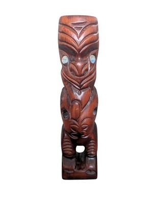 Maori hand-carved wood Teko Teko totem statue with mother-of-pearl eyes.