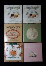 6 Longaberger basket tie ons in original packaging and box.