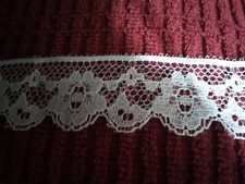Lace 1-1/4" wide white 2.00 per yard 12 yards available