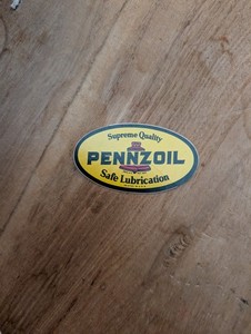 This is a vintage Pennzoil "Safe Lubrication" oval sticker, often sought...