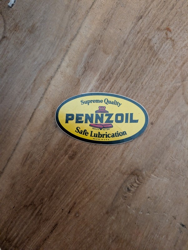 This is a vintage Pennzoil "Safe Lubrication" oval sticker, often sought...