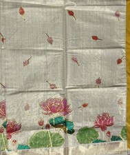 Tissue saree, kerala style, elegant in ivory with hand painting and embroidery.