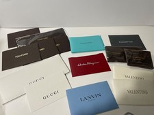 LOT OF VAIRIED EYEGLASS AUTHENTICITY CARDS AN...