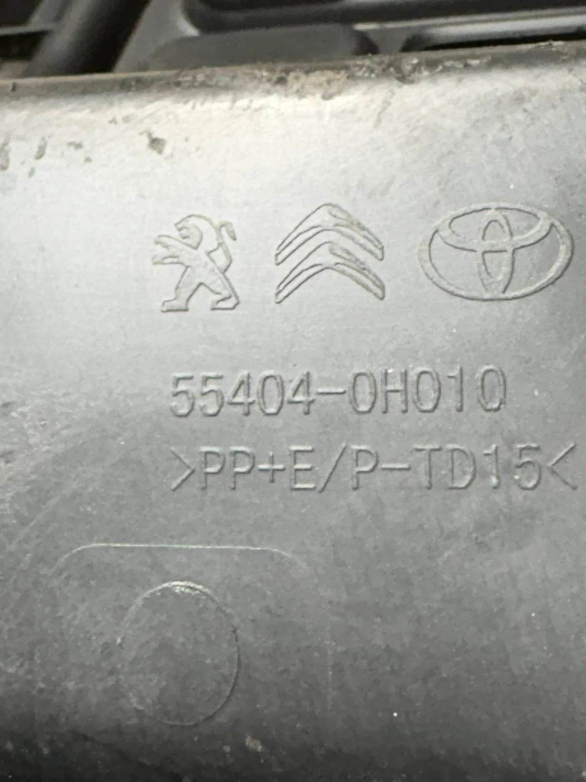 Part number 55404-0H010 and manufacturer markings