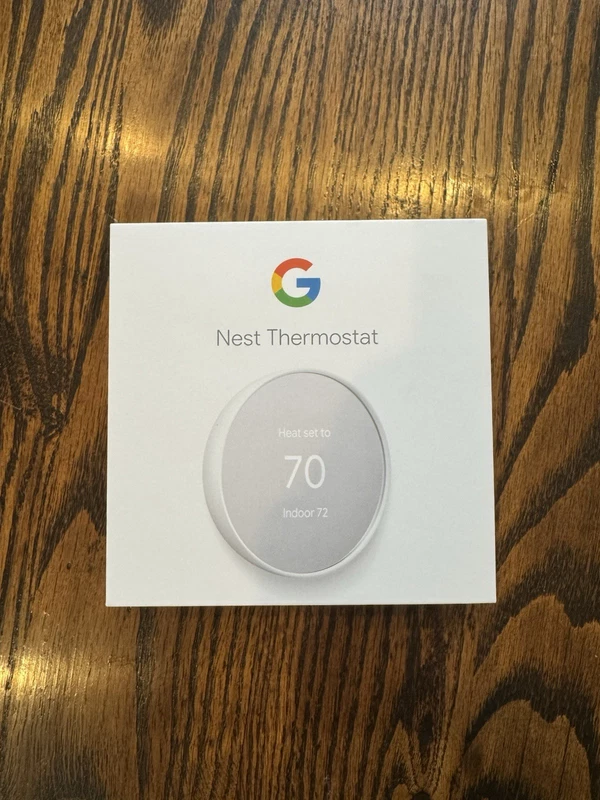 used Google Nest Smart Thermostat in white