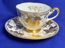 Royal Chelsea china gold decorated leaf and berry cup and saucer