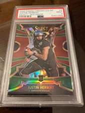 2020 Panini Chronicles Draft Pick Justin Herbert Rookie Card # 4 Red Prizm PSA 9. rookie card picture