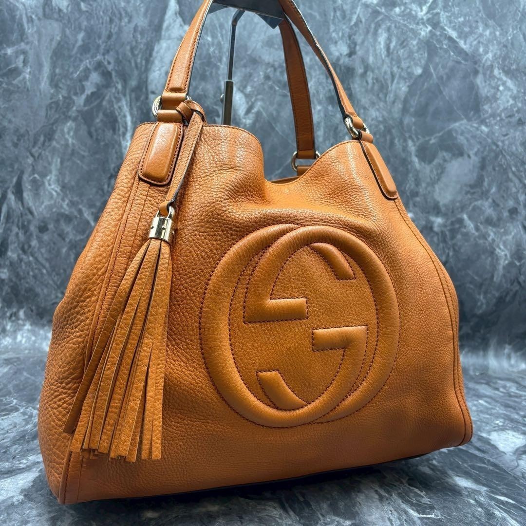 Borsa a tracolla Gucci GG Soho arancione in pelle nappa raccordi in metallo...