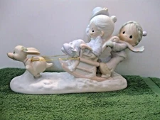 Precious Moments Figurine #109819 "Oh What Fun It Is To Ride" Mint in box.