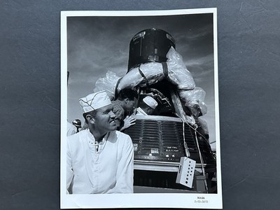 1963 NASA Astronaut L. Gordon Cooper, Jr., Rests Mercury Spacecraft Photograph