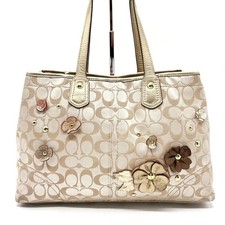 Bolso de mano COACH Y2K Signature de lona con tachuelas con flores beige para mujer