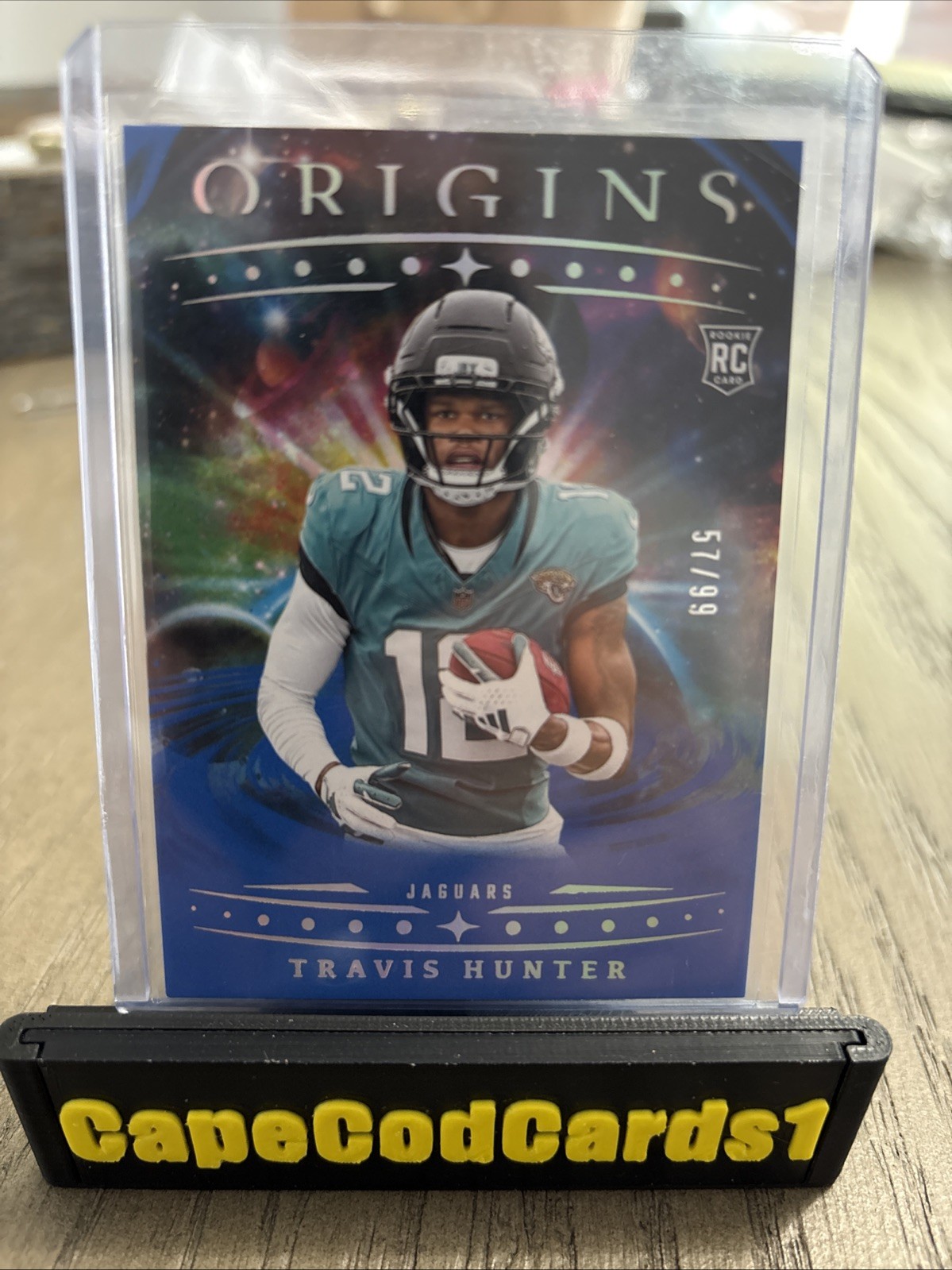 2025 Panini Origins - Rookies Travis Hunter, Travis Hunter #142 Blue /99 (RC)