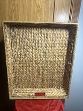 hand-woven water hyacinth and rattan rectangular serving tray with handles.