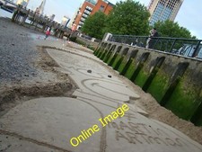 Photo 12x8 Homer Simpson in the sand London This sculpture of Homer Simpso c2014