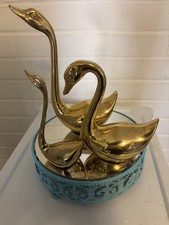 Threebrass Swans And A Mirrored Stand