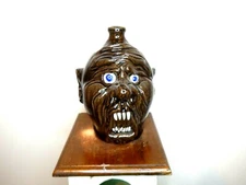 dwayne crocker face jug,pottery, folk art 11 inches tall x8.5 wide