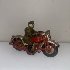 Cast iron toy motorcycle with police rider, circa 1930 likely Hubley Man.Company