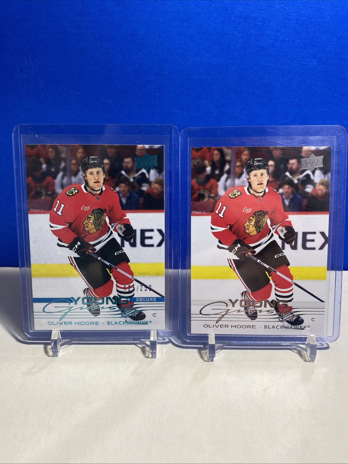 2025-26 Upper Deck Series 1 Oliver Moore Young Guns Deluxe /250 #216 + Regular